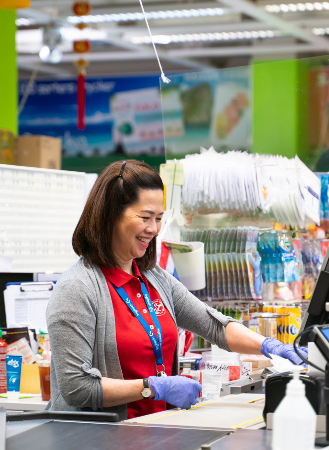 Saigon food employee working as a cashier