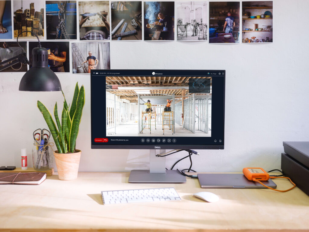 Monitor on desk with video feed from construction site